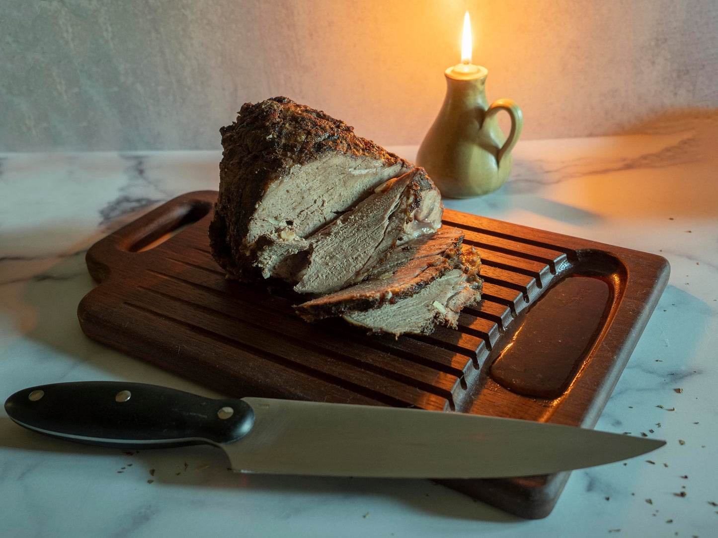 Walnut cutting board with groves and reservoir for draining and holding meat juice